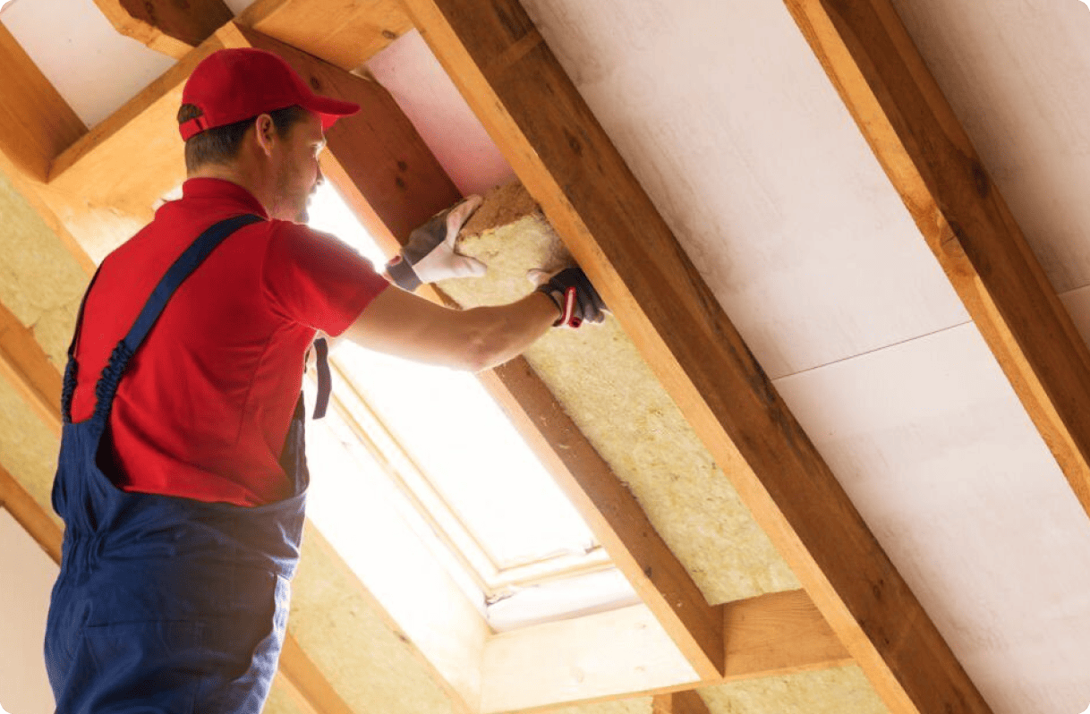 Man working on wall insulation